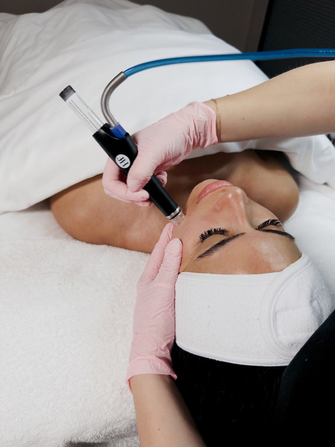 Client receiving a HydraFacial at Young & Bloom Skin Spa — summer skincare in Saratoga Springs