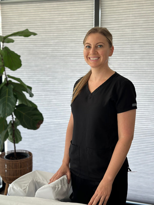Headshot for Clare getting ready for a Massage therapy session at Young and Bloom Skin spa, designed for relaxation
