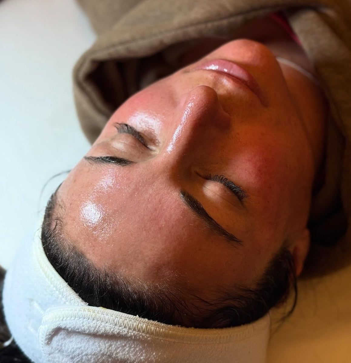 A happy customer with Radiant Skin after a relaxing custom facial at Young & Bloom Skin in Saratoga Springs