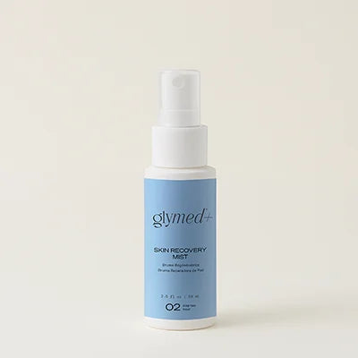 glymed recovery mist bottle with blue label branding in front of a an all white background