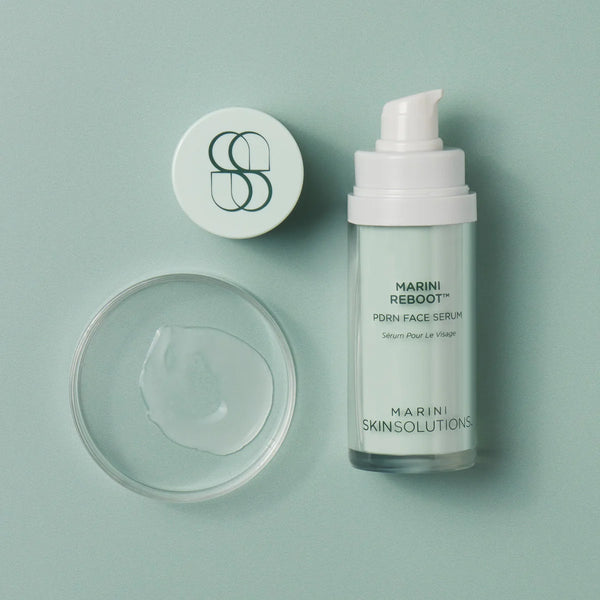 Marini Reboot Pore Face Serum bottle and container on a light green background