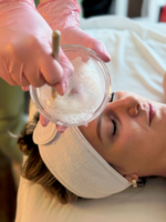 Esthetician prepping a cooling mask at Young & Bloom Skin prior to refreshing HydraFacial