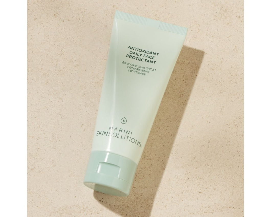 One tube of Marini Skin Solutions Antioxidant Daily Face Protectant SPF 33 on a tile background