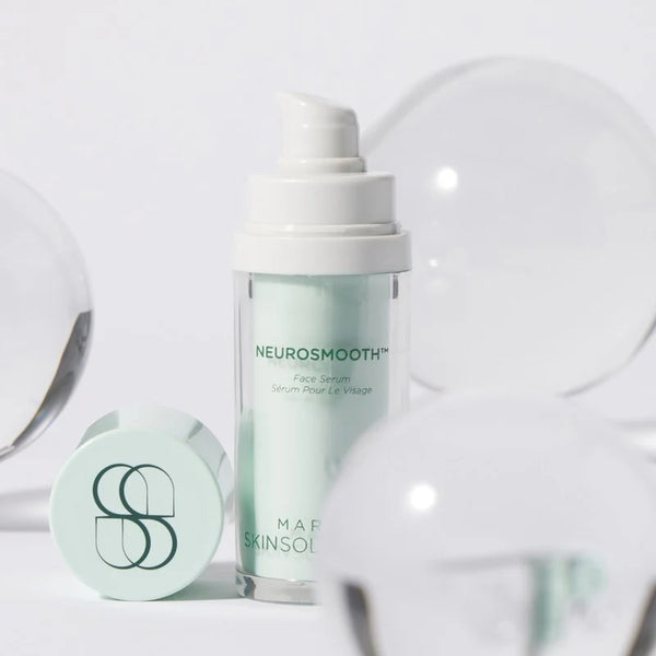 NeurosMOOTH skincare serum bottle with cap on a light gray background