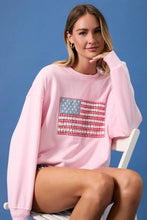 Load image into Gallery viewer, Woman wearing a pink sweatshirt with an American flag design on a blue background
