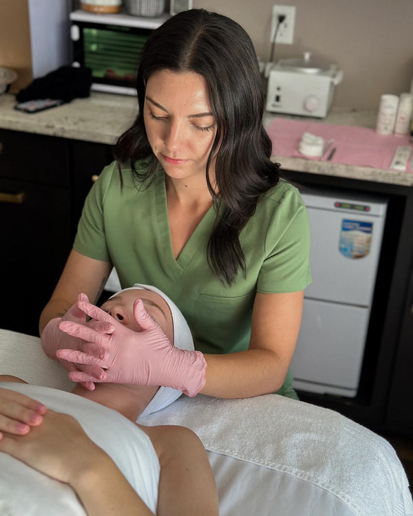 Customer receiving a rejuvenating facial treatment at Young and Bloom Skin spa